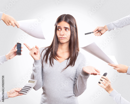 Young busy woman working, multitasking concept