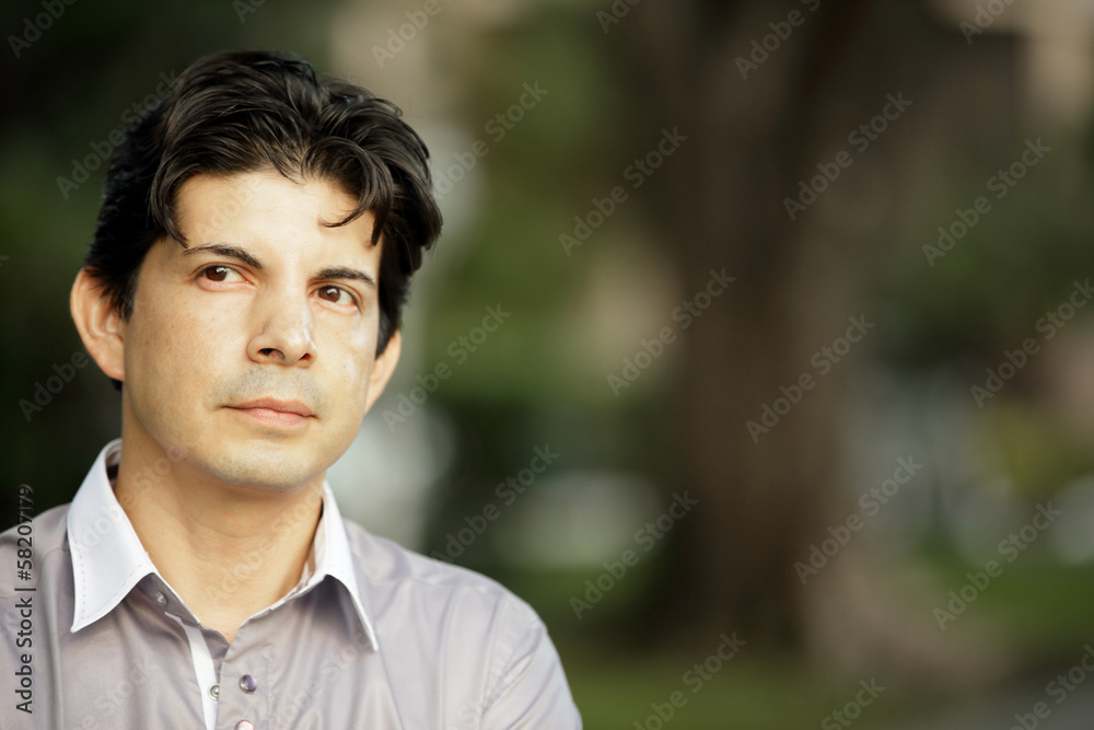 Headshot of a businessman on a blurry background Headshot of a businessman on a blurry background