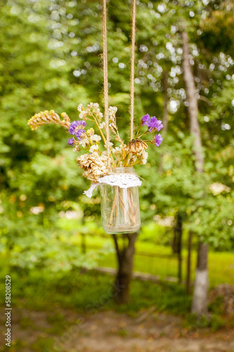 vintage bouquet of dried flowers in a jar