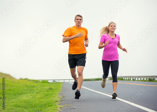 Fitness sport couple running jogging outside