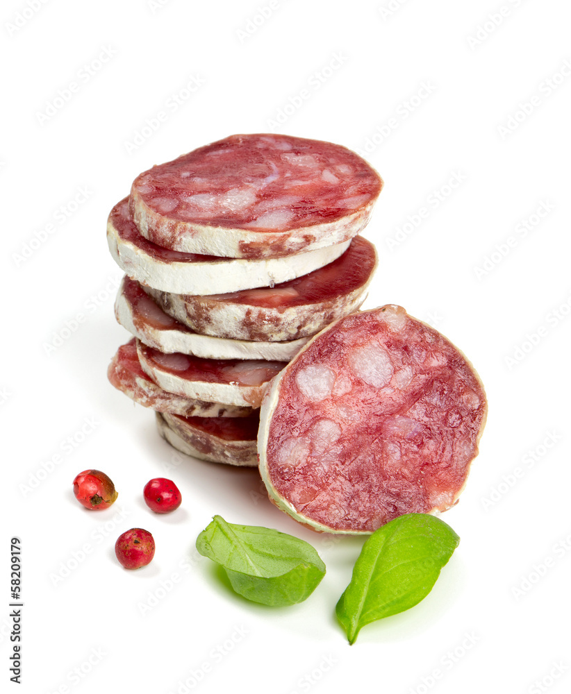 stacked sliced salami isolated on white