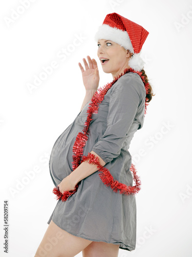 a pregnant woman  with a red Christmas had photo