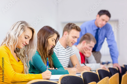 Teacher with college students in the classroom