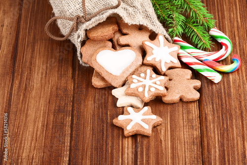 bag of cookies and candy over wooden board