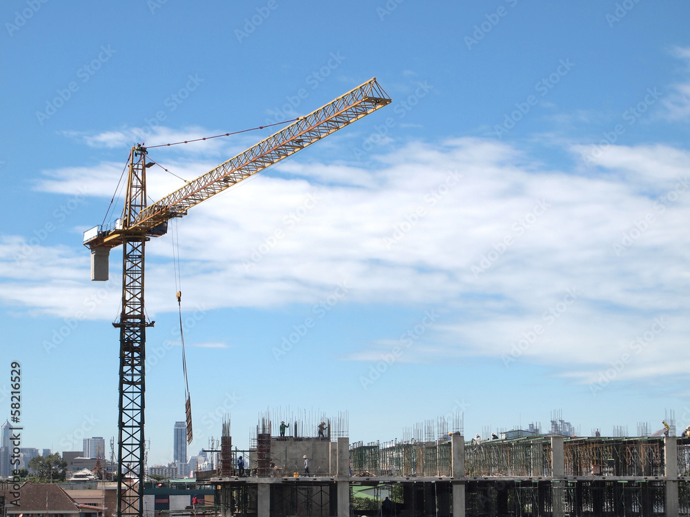 Industrial landscape with cranes on the blue sky Industrial landscape with cranes on the blue sky