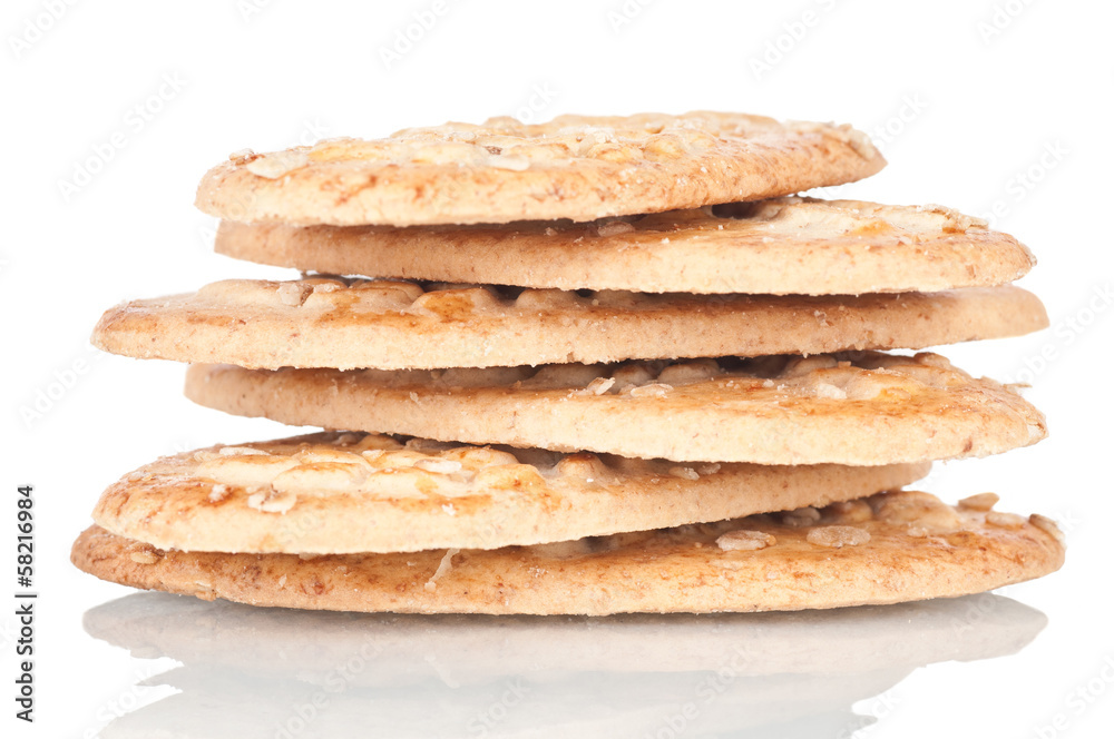 Pile of integral biscuits over a white reflective background