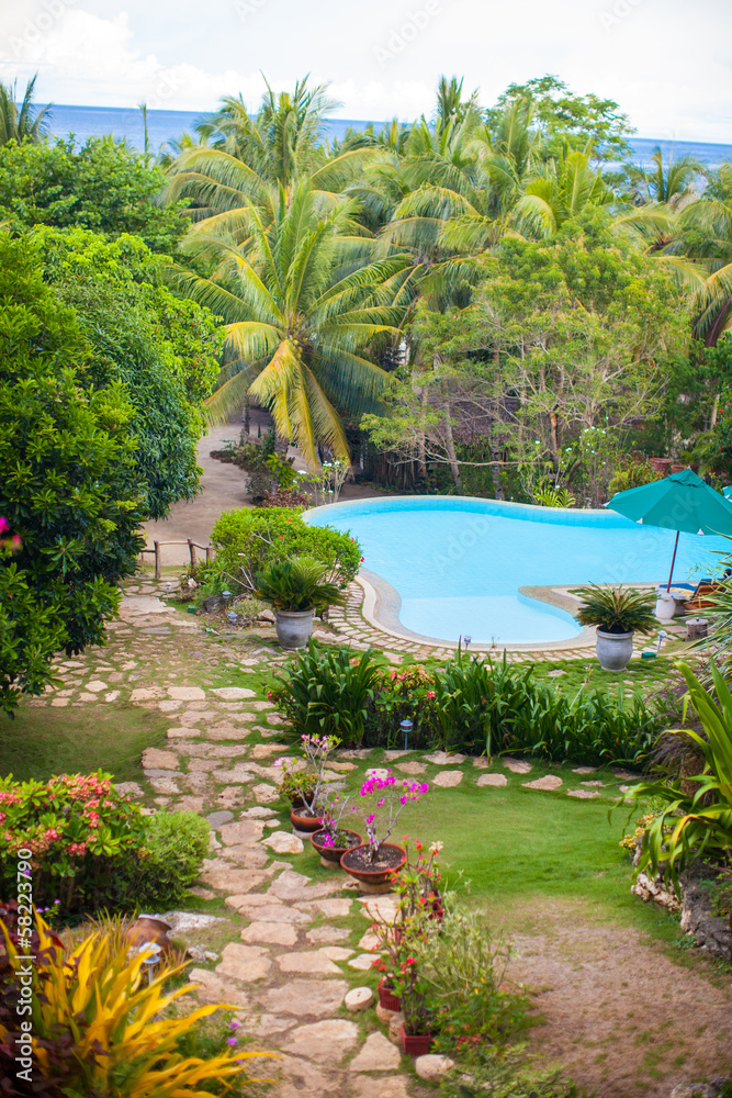 Nice view of the garden and swimming pool in a cozy little hotel