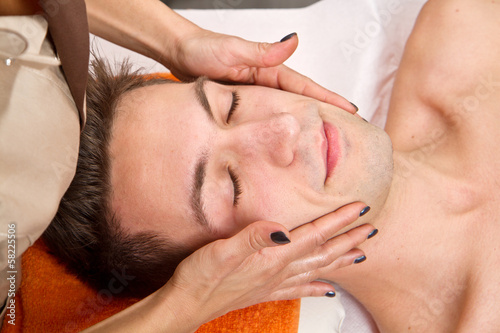 Man getting massage in thebeauty center photo