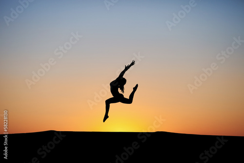 Wallpaper Mural silhouette of female dancer in sunset sky Torontodigital.ca