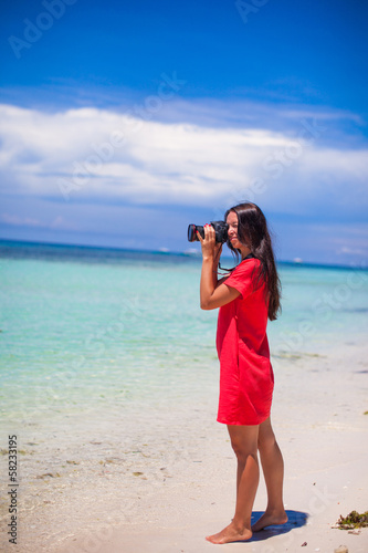 Profile of young beautiful woman photographed beautiful seascape