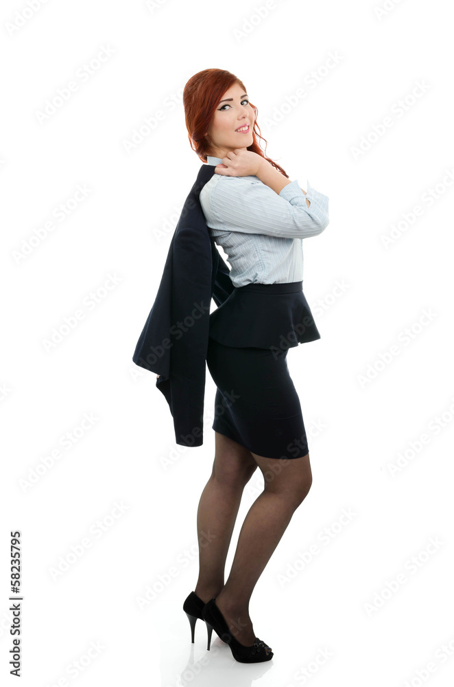 Successful business woman with coat over her shoulder