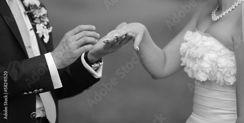 Hands of wedding couple.