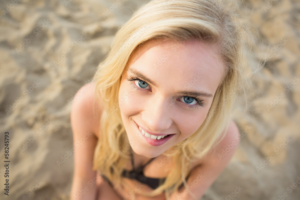 Smiling relaxed young blond at beach