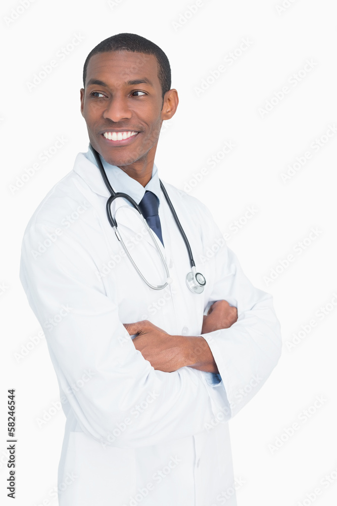 Smiling male doctor standing with arms crossed Smiling male doctor standing with arms crossed