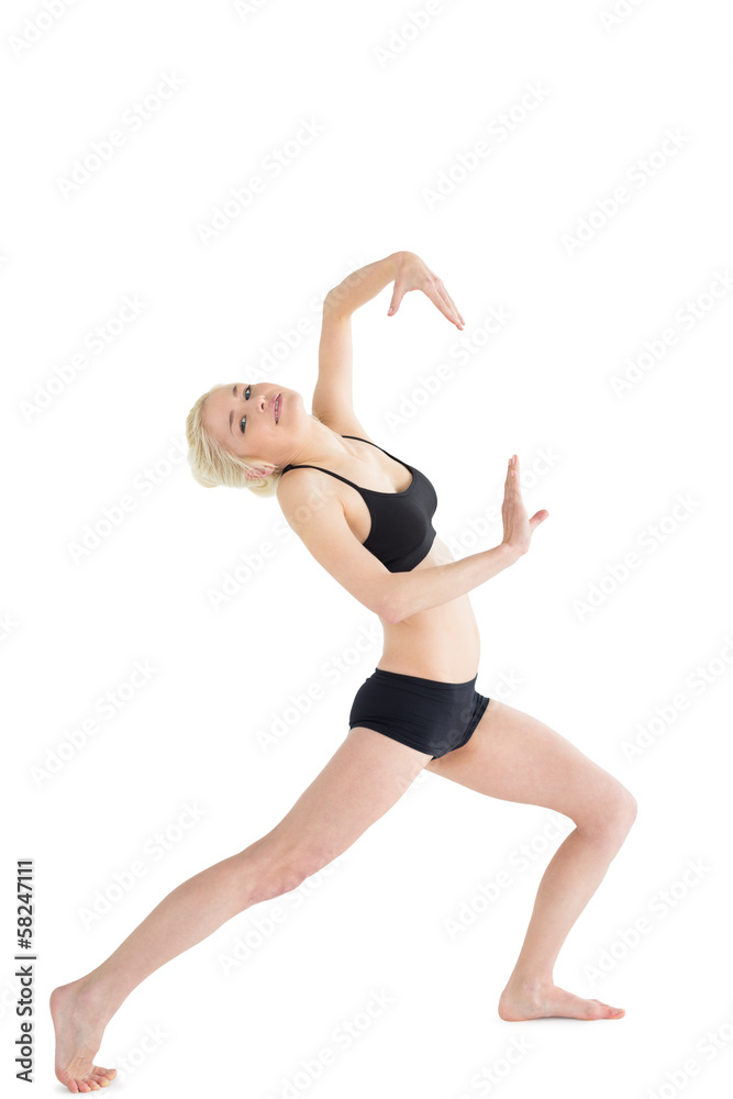 Full length portrait of a sporty young woman dancing Full length portrait of a sporty young woman dancing
