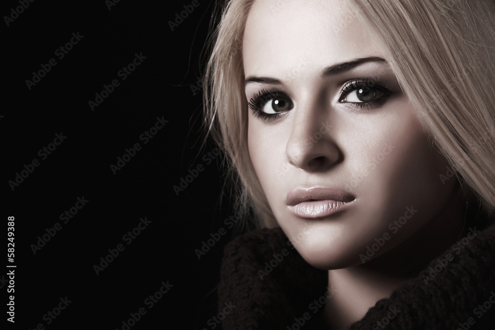 portrait of beautiful blond woman. black background portrait of beautiful blond woman. black background
