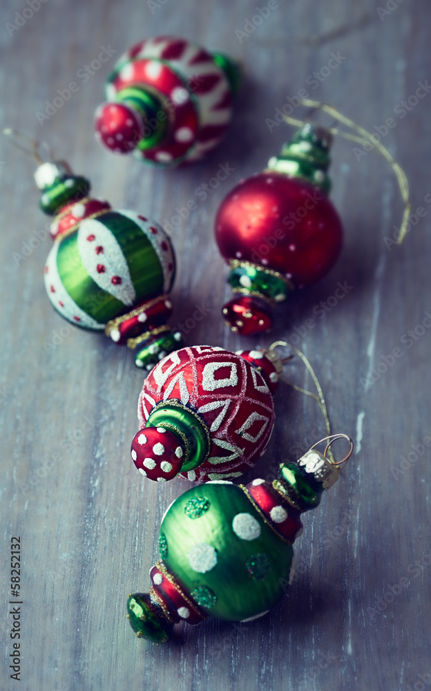 Colorful christmas ornaments on wooden background