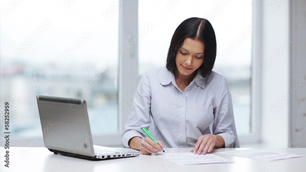 woman with documents and pen filling form woman with documents and pen filling form