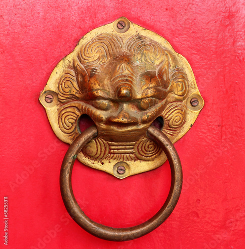 vintage door handle on red door  Thai temple