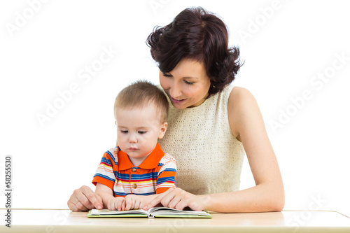mother reading a book to he...