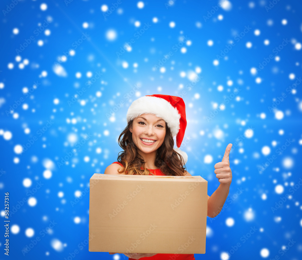 smiling woman in santa helper hat with parcel box smiling woman in santa helper hat with parcel box