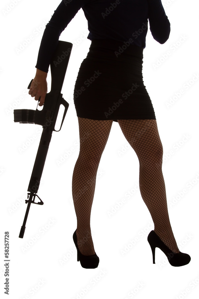 Dangerous woman in black with assault rifle Dangerous woman in black with assault rifle