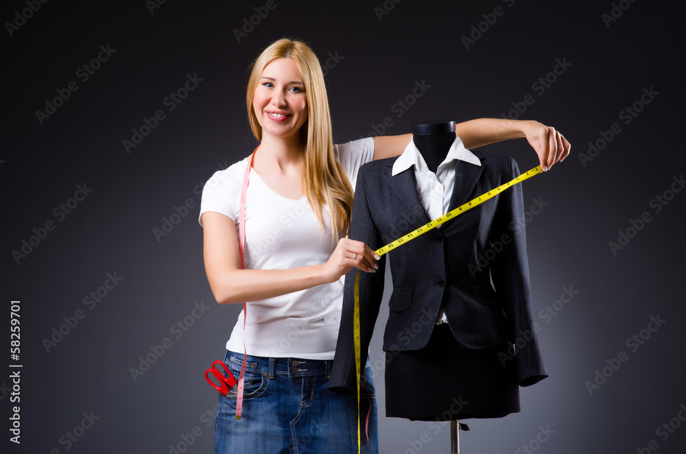 Young tailor isolated on the white Young tailor isolated on the white