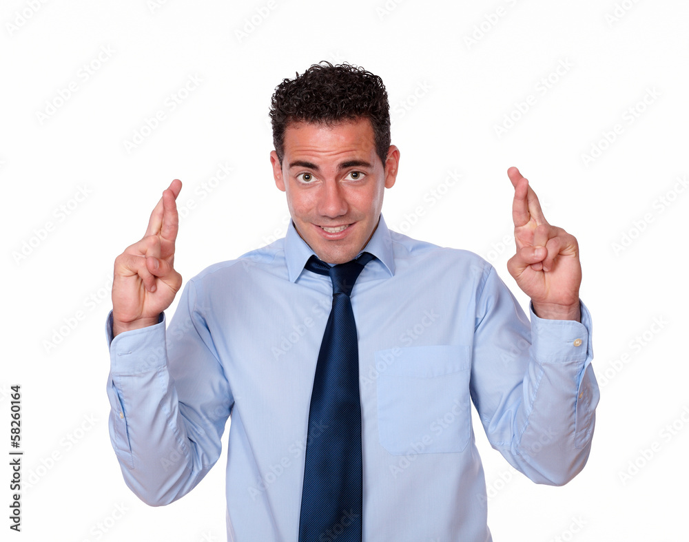 Charming latin male crossing his fingers