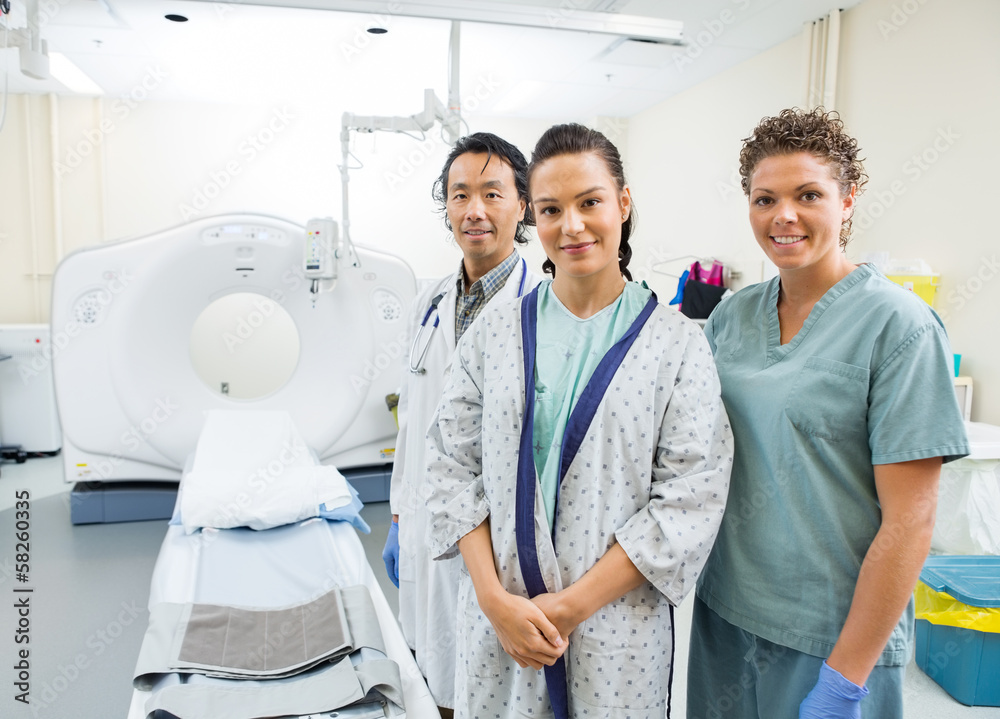 Obraz premium Medical Team With Patient In CT Scan Room