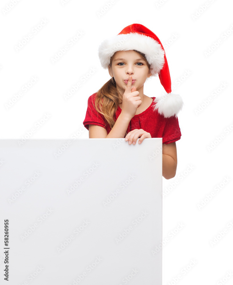 child in santa helper hat with blank white board child in santa helper hat with blank white board