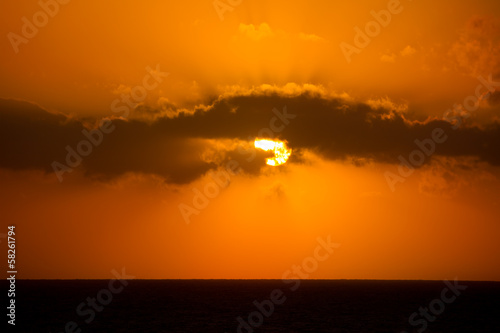 Golden orange sunset with sun in Mediterranean