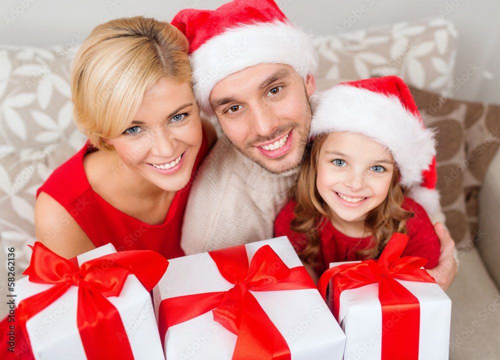 smiling family holding many gift boxes smiling family holding many gift boxes