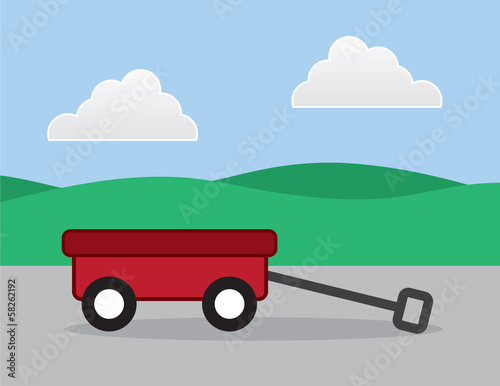 Red wagon outside on a sidewalk