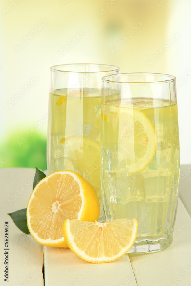 Delicious lemonade on table on light background Delicious lemonade on table on light background