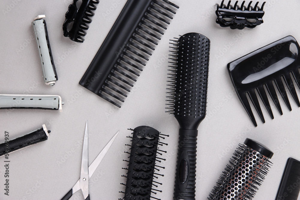 Professional hairdresser tools on gray background Professional hairdresser tools on gray background