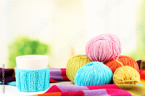 Multicolored clews with cup and bright scarf closeup