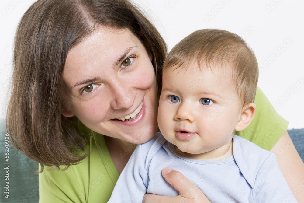 Happy mother embracing her sweet baby boy. Happy mother embracing her sweet baby boy.