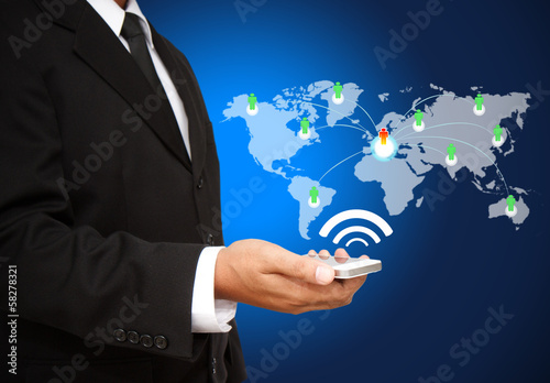 Businessman holding the Phone with social network structure