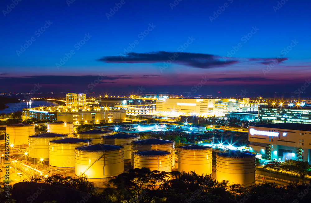 Oil tanks plant during sunset