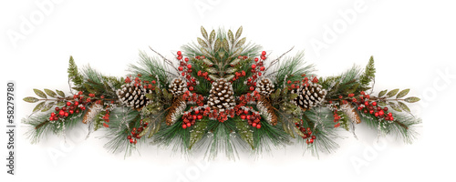 Christmas garland decorated with pine cones and red berries