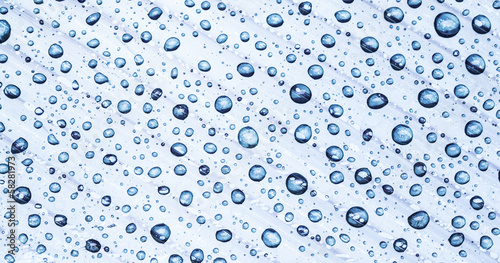 Water drops on a plastic background.