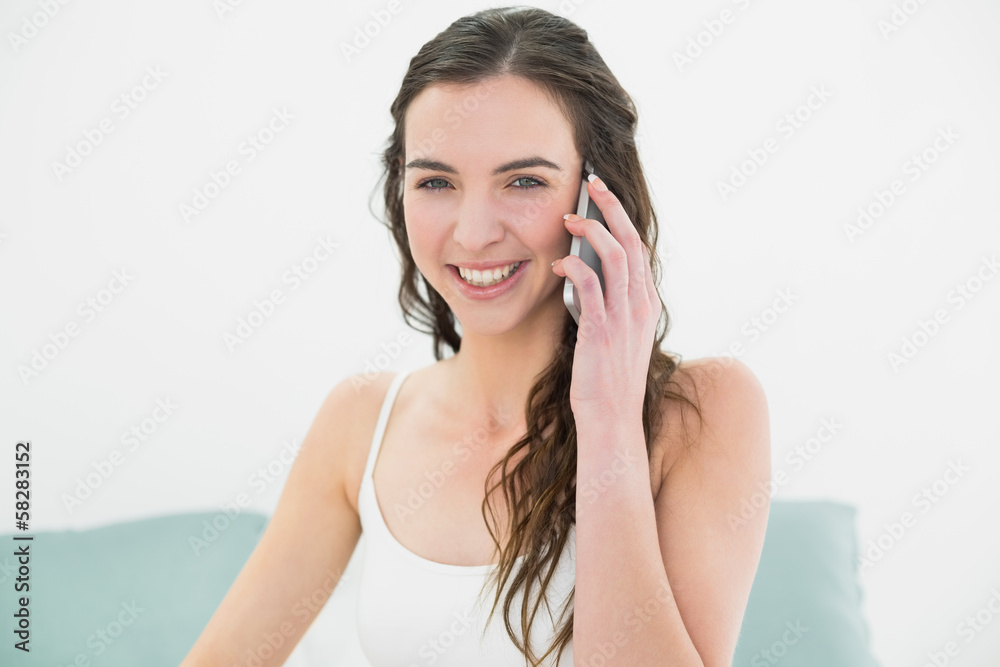 Fototapeta premium Portrait of relaxed woman using mobile phone