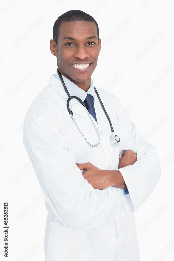 Portrait of a smiling male doctor with arms crossed Portrait of a smiling male doctor with arms crossed