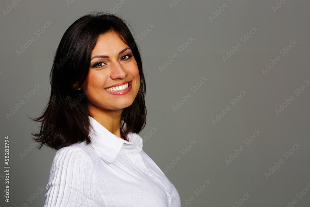 Portrait of a cheerful beautiful woman on gray background Portrait of a cheerful beautiful woman on gray background
