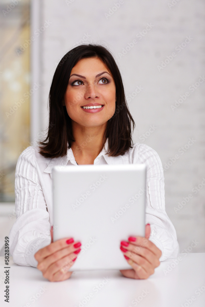 Happy beautiful businesswoman holding tablet computer Happy beautiful businesswoman holding tablet computer