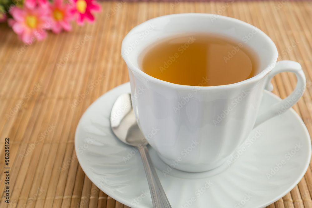 A cup of tea on bamboo mat A cup of tea on bamboo mat