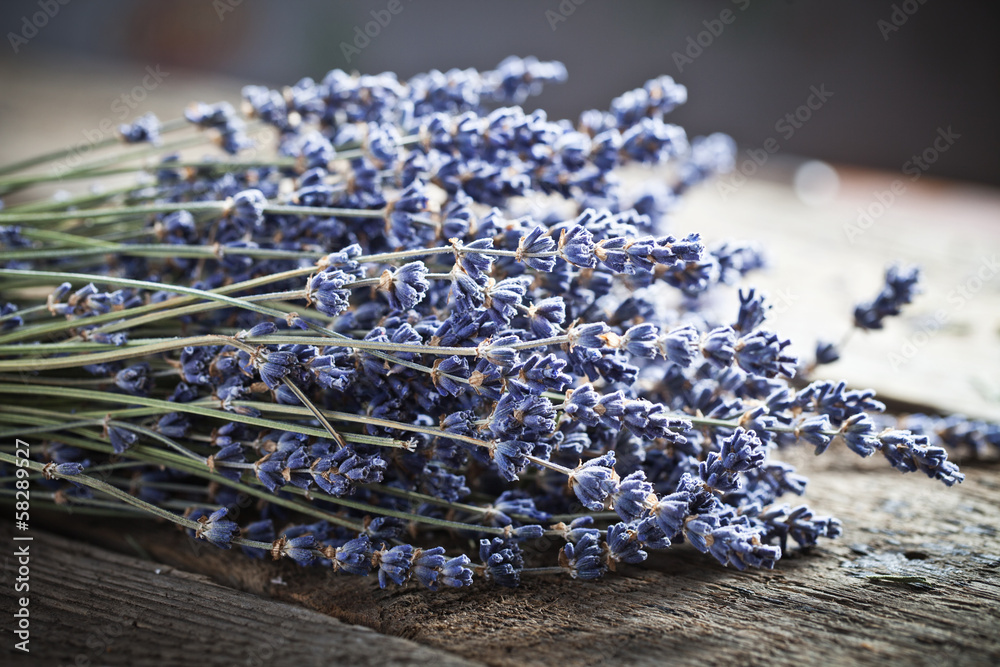 Bunch of lavender flowers on an old wood table - obrazy, fototapety, plakaty 