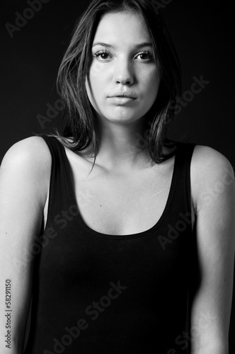 Young woman over black
