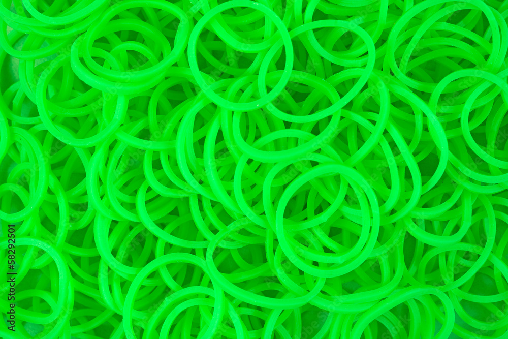 A Close View Of Plastic Neon Green Loom Bands