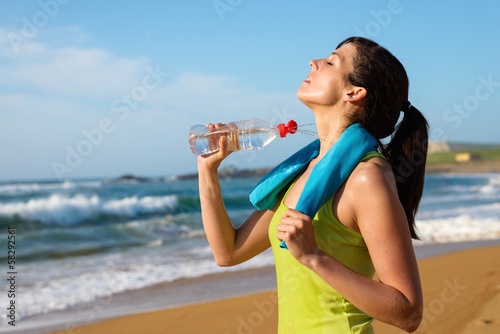 Woman drinking after running